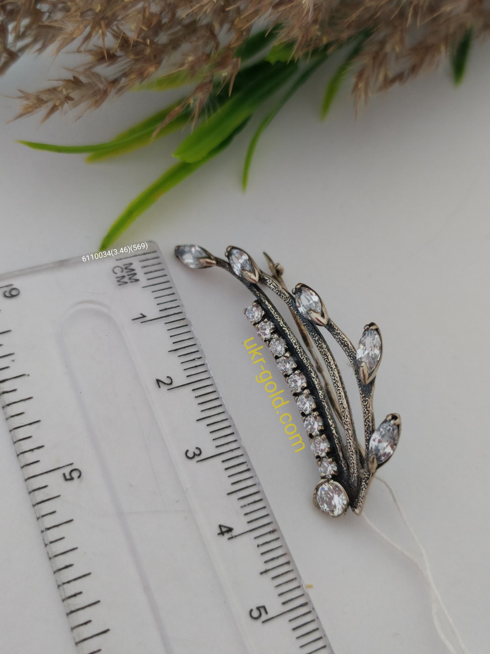 Срібна брошка