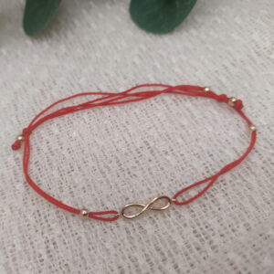 Червона ниточка в золоті 585 проби , розмір регулюється