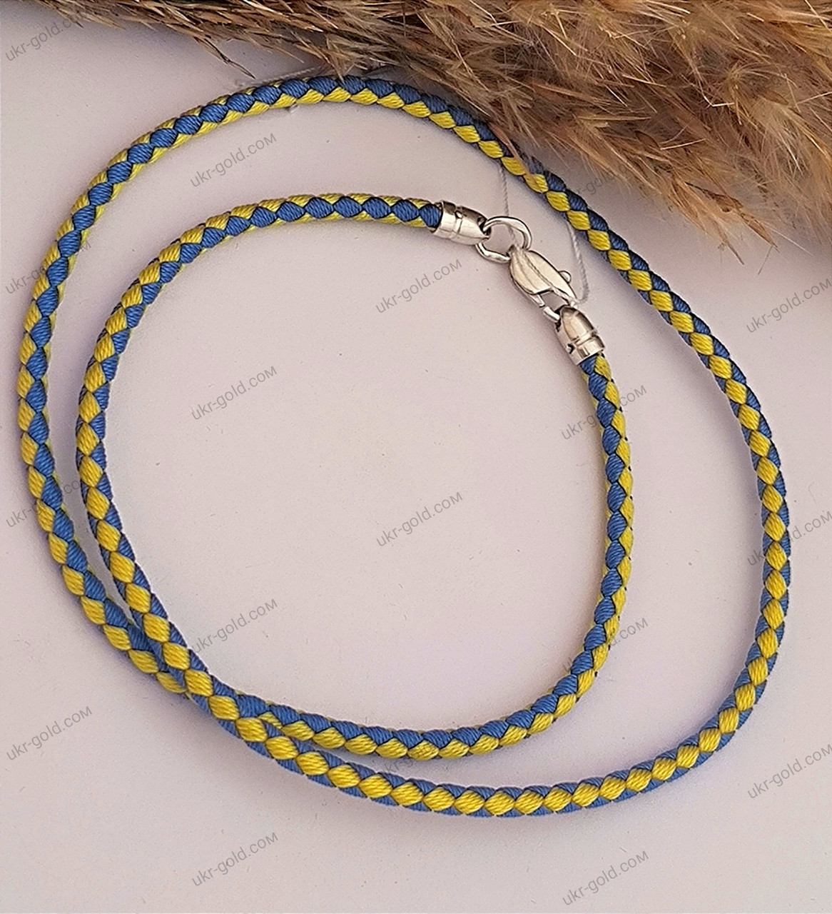 Жовто-блакитний шнурок з срібними вставками 925 проби