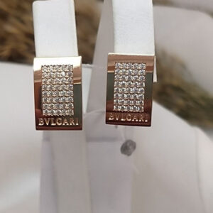 Золоті сережки в червоному золоті 585 проби на англійськомку замку з вставкою цирконію