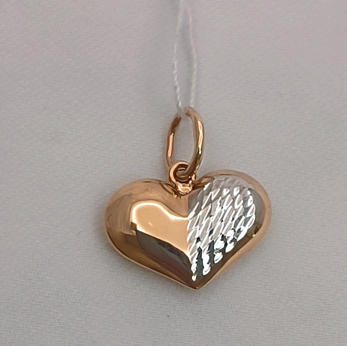 Золотий кулон серце