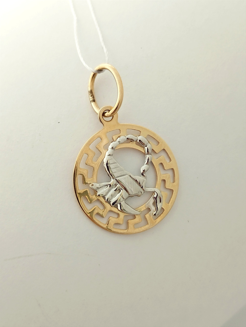 Золотий кулон