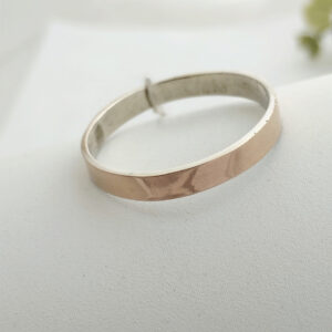 Срібне обручне кільце із золотими пластинами